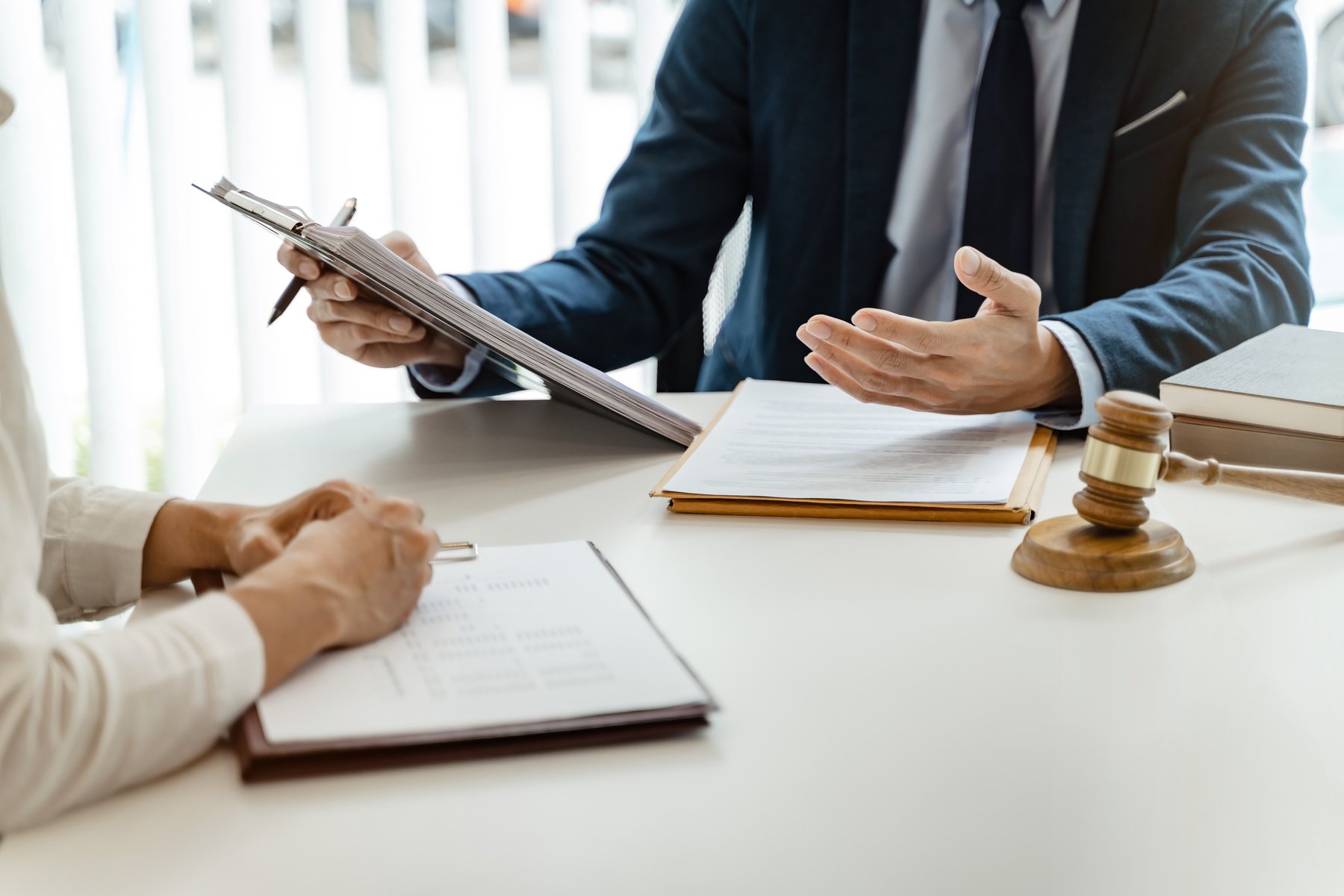 Lawyer Legal Counsel Presents to the Client a Signed Contract Wi